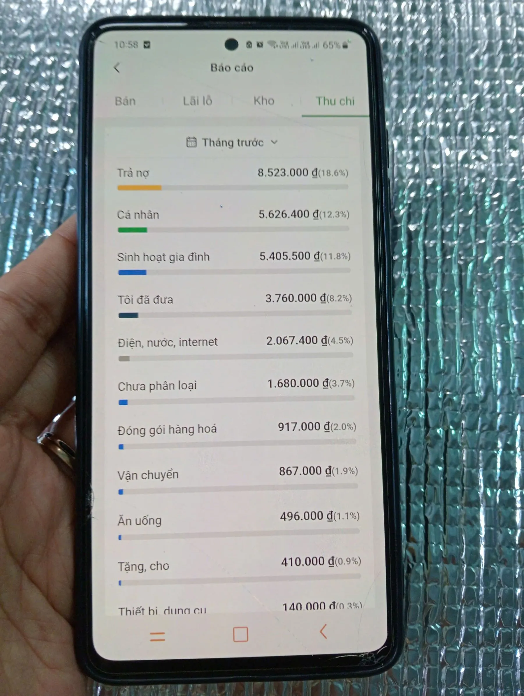 A close-up of a smartphone screen displaying the interface of a financial or sales management application, likely the Sổ Bán Hàng app.