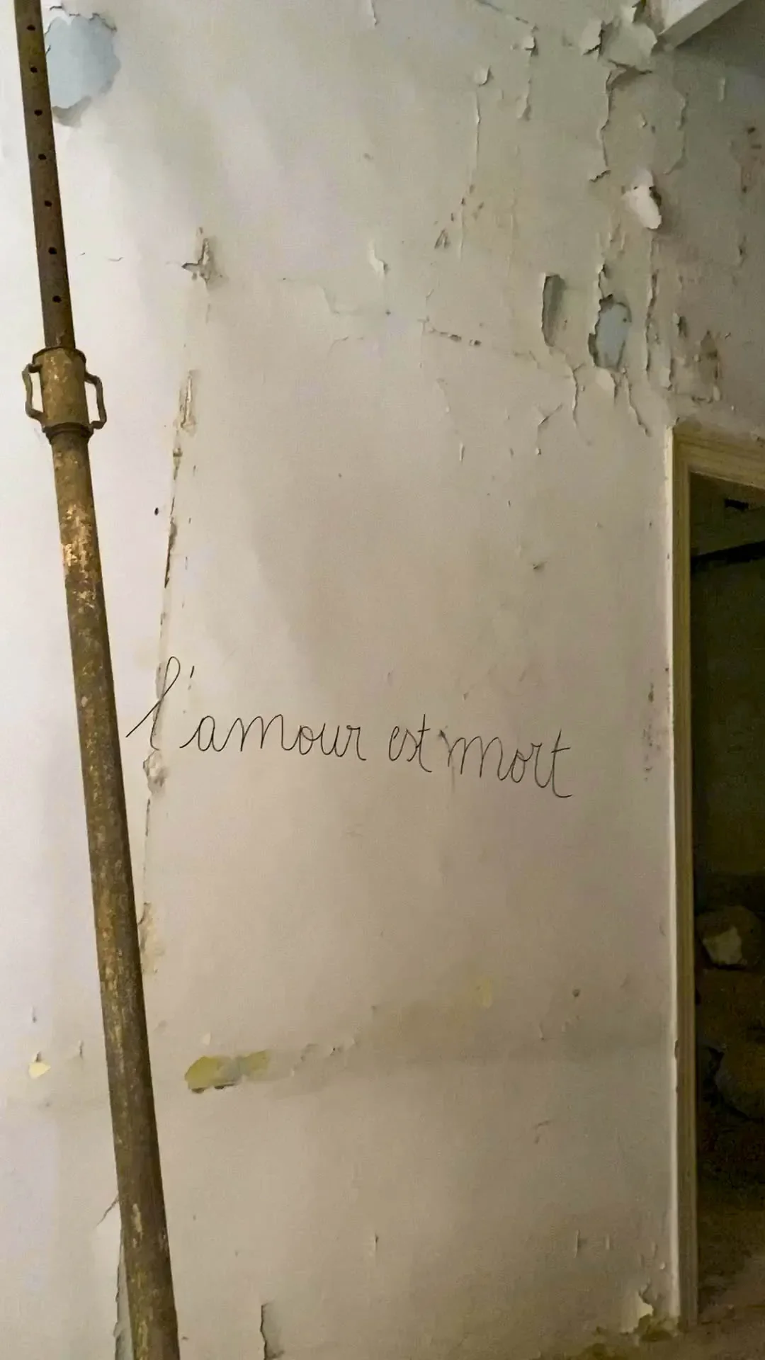 Graffiti on a wall reading 